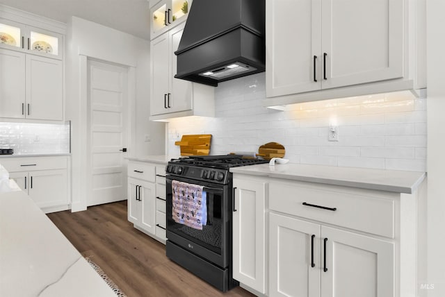 11127 Lake Lowell Ave, Nampa, ID 83686 - kitchen with gas stove, custom range hood, and white cabinetry