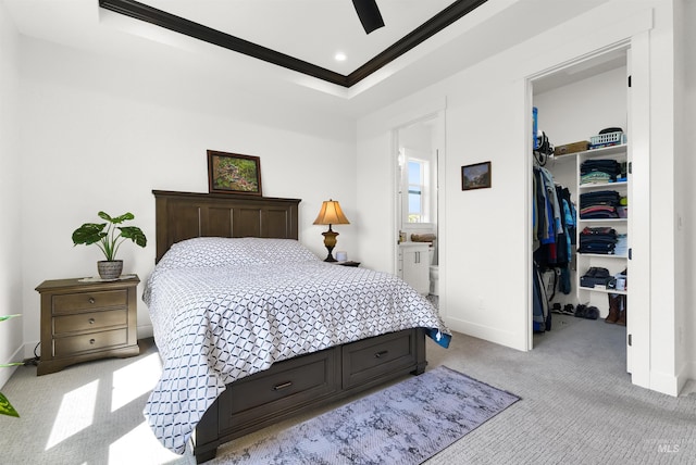 11127 Lake Lowell Ave, Nampa, ID 83686 - bedroom featuring a walk in closet, light carpet, crown molding, a closet, and baseboards