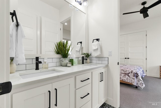 11127 Lake Lowell Ave, Nampa, ID 83686 - bathroom featuring backsplash, double vanity, ceiling fan, and baseboards