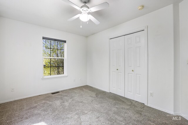 224 Paintbrush Cir, Twin Falls, ID 83301 - unfurnished bedroom featuring carpet floors, a closet, baseboards, and a ceiling fan