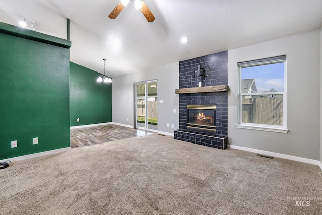 224 Paintbrush Cir, Twin Falls, ID 83301 - unfurnished living room featuring carpet floors, plenty of natural light, ceiling fan, baseboards, and lofted ceiling