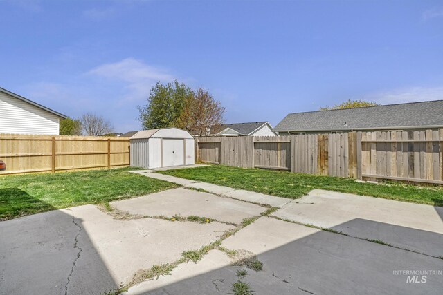 224 Paintbrush Cir, Twin Falls, ID 83301 - view of yard featuring a patio, a storage unit, and an outbuilding