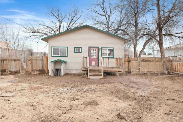 back of property featuring fence