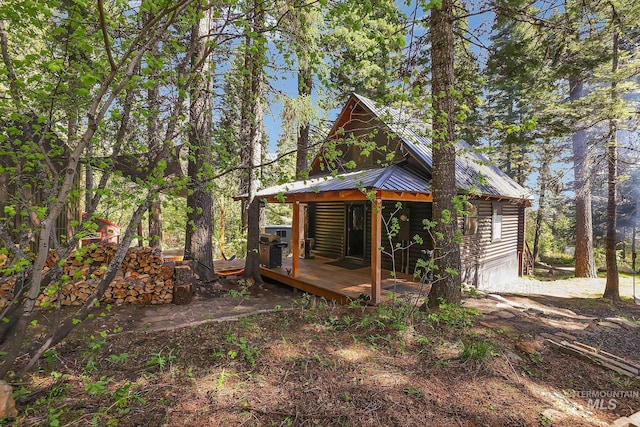 1221 Fox Rd, Cascade, ID 83611 - view of property exterior featuring metal roof, a wooden deck, and log siding