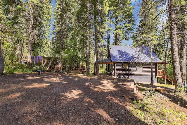 1221 Fox Rd, Cascade, ID 83611 - rear view of house featuring metal roof and log siding
