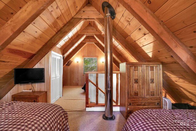 1221 Fox Rd, Cascade, ID 83611 - bedroom with lofted ceiling, wood walls, wood ceiling, and carpet floors
