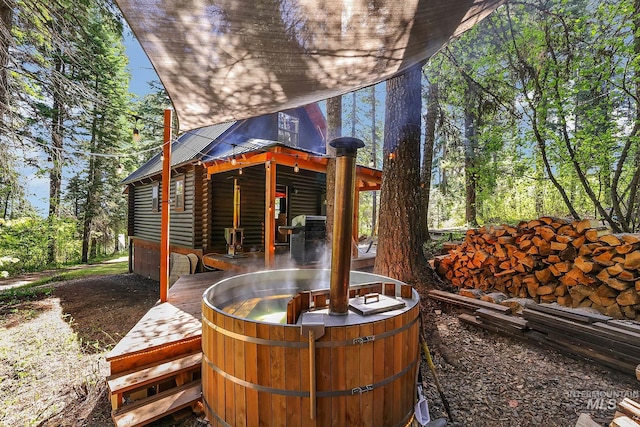 1221 Fox Rd, Cascade, ID 83611 - view of patio / terrace featuring a hot tub