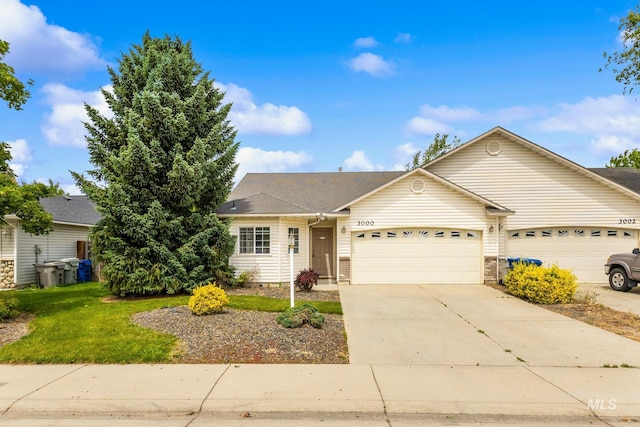 3000 E Ohio Ave, Nampa, ID 83686 - ranch-style home featuring a garage, driveway, and a front yard