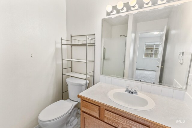 3000 E Ohio Ave, Nampa, ID 83686 - full bath with toilet, vanity, and a shower