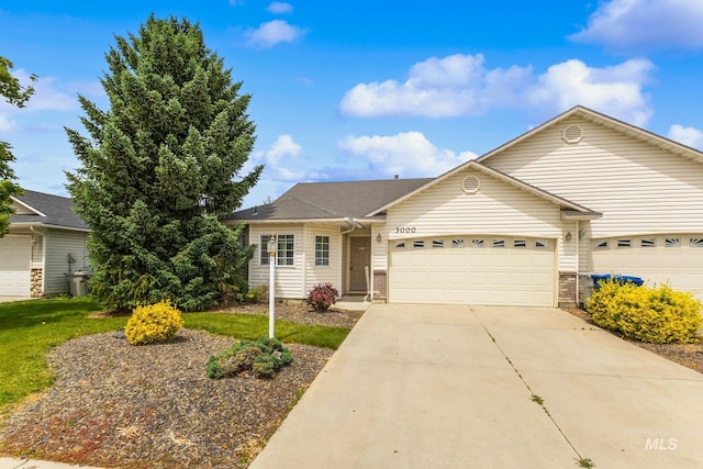 3000 E Ohio Ave, Nampa, ID 83686 - ranch-style home featuring a garage, concrete driveway, and brick siding