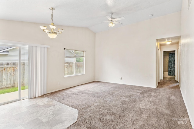3000 E Ohio Ave, Nampa, ID 83686 - empty room featuring carpet, a chandelier, vaulted ceiling, a ceiling fan, and baseboards