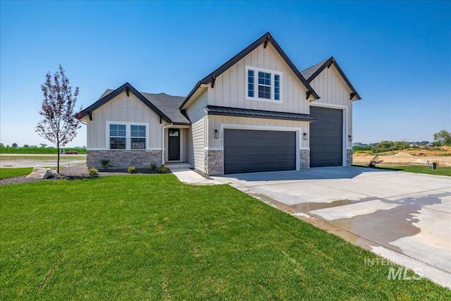 view of front of house with a front yard and a garage