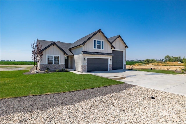 view of front of property featuring a front yard and a garage