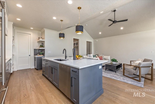 kitchen featuring gray cabinetry, a textured ceiling, sink, decorative light fixtures, and dishwasher