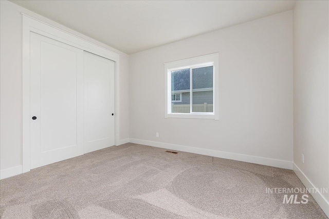 3484 W Retreat St Lot 23/6, Eagle, ID 83616 - unfurnished bedroom with light colored carpet, a closet, and baseboards