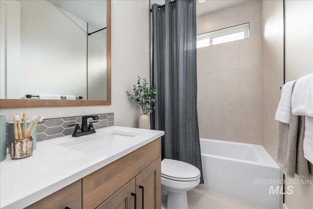 3484 W Retreat St Lot 23/6, Eagle, ID 83616 - bathroom featuring vanity, tasteful backsplash, toilet, and shower / tub combo with curtain