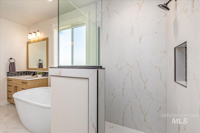 bathroom with vanity and independent shower and bath