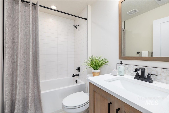 3484 W Retreat St Lot 23/6, Eagle, ID 83616 - bathroom featuring toilet, vanity, shower / bath combination with curtain, and decorative backsplash