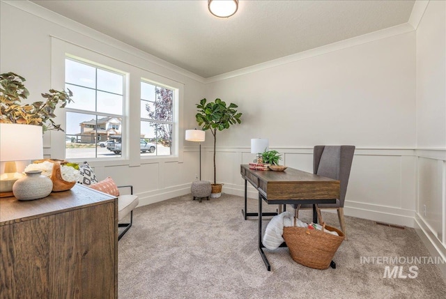 carpeted office space with ornamental molding