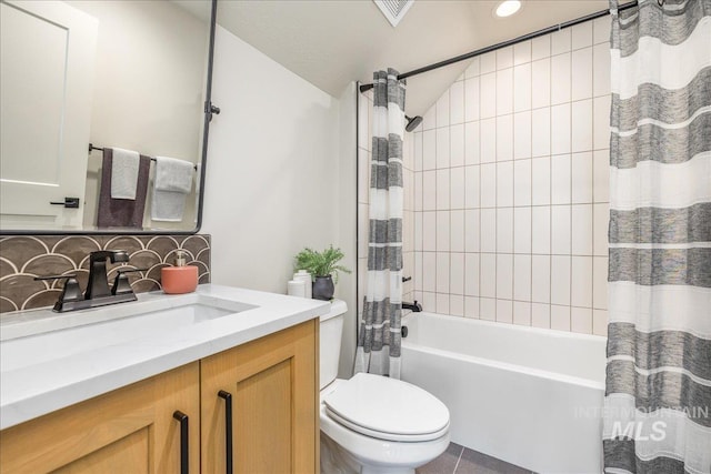 full bathroom featuring vanity, tile patterned floors, vaulted ceiling, decorative backsplash, and shower / bathtub combination with curtain