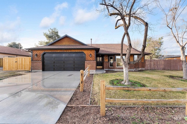 ranch-style house featuring fence, an attached garage, concrete driveway, a front lawn, and brick siding