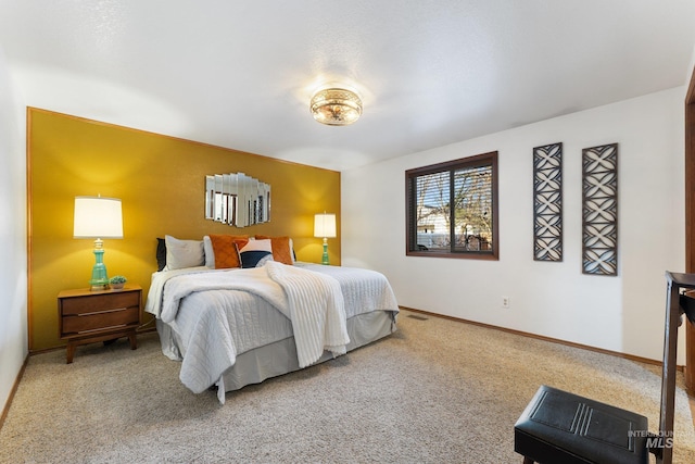 bedroom featuring baseboards and carpet floors