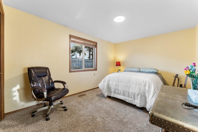 bedroom with baseboards and carpet flooring