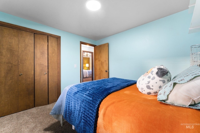 carpeted bedroom featuring a closet