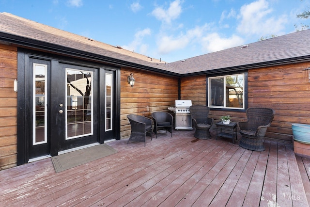 wooden terrace featuring area for grilling