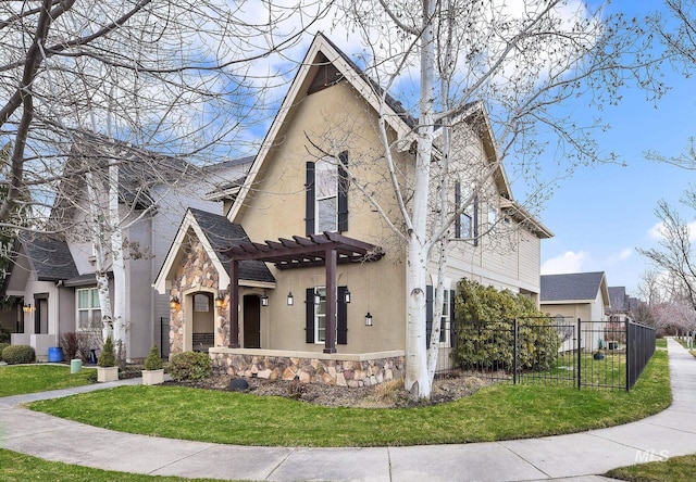 view of home's exterior with stone siding, fence, a yard, a pergola, and stucco siding