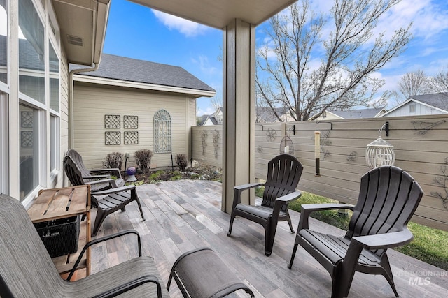 view of patio featuring fence