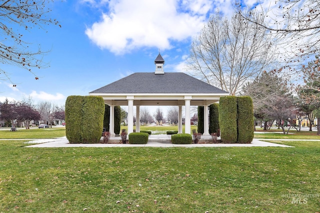 view of home's community with a gazebo and a yard