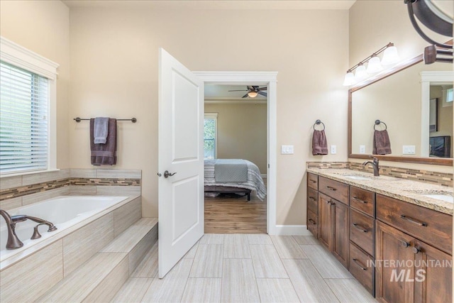 11954 W Meadowfalls Dr, Star, ID 83669 - full bathroom featuring ensuite bathroom, double vanity, a garden tub, and a ceiling fan