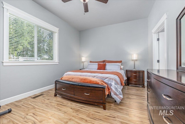 11954 W Meadowfalls Dr, Star, ID 83669 - bedroom with light wood finished floors and a ceiling fan