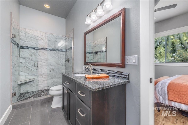11954 W Meadowfalls Dr, Star, ID 83669 - full bathroom featuring a marble finish shower, vanity, and ensuite bath