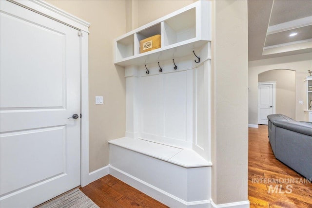11954 W Meadowfalls Dr, Star, ID 83669 - mudroom featuring wood finished floors and arched walkways