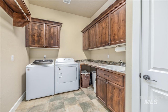 11954 W Meadowfalls Dr, Star, ID 83669 - laundry room with cabinet space, separate washer and dryer, and stone finish flooring