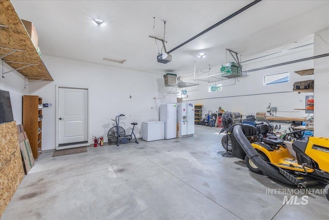 11954 W Meadowfalls Dr, Star, ID 83669 - garage featuring fridge and a garage door opener