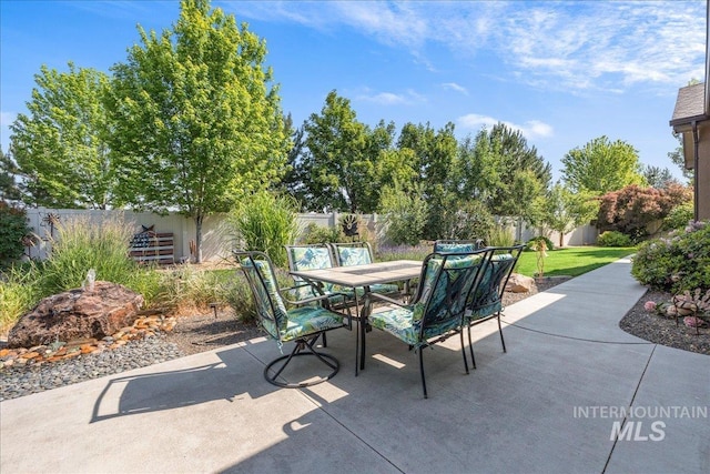 11954 W Meadowfalls Dr, Star, ID 83669 - fenced backyard featuring outdoor dining area and a patio area