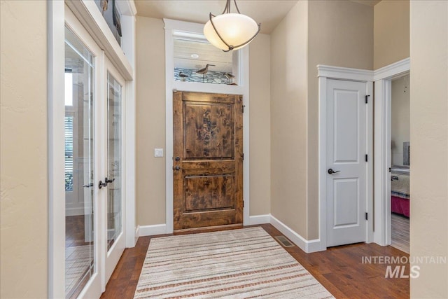 11954 W Meadowfalls Dr, Star, ID 83669 - entrance foyer with dark wood finished floors and french doors