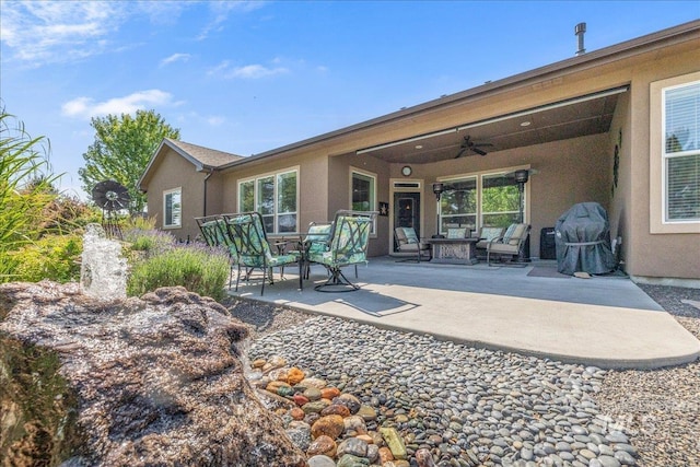 11954 W Meadowfalls Dr, Star, ID 83669 - rear view of property featuring stucco siding, ceiling fan, a patio, and an outdoor hangout area