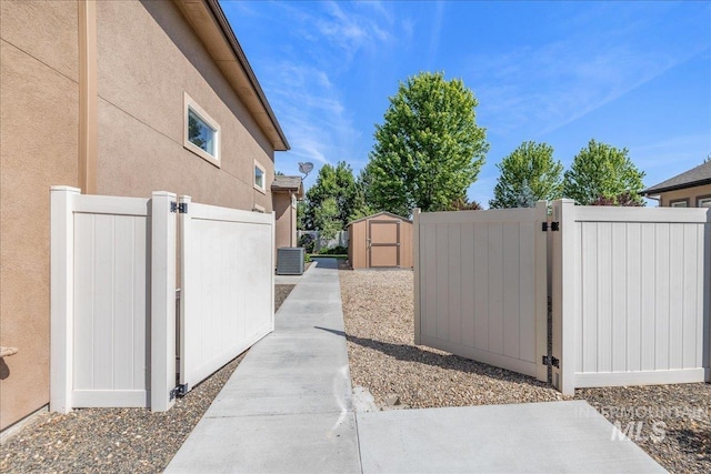 11954 W Meadowfalls Dr, Star, ID 83669 - view of home's exterior featuring a gate, a storage shed, and stucco siding