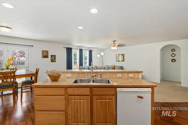 4456 N Weston Ave, Meridian, ID 83646 - kitchen featuring dishwasher, a sink, open floor plan, light countertops, and an island with sink