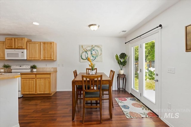 4456 N Weston Ave, Meridian, ID 83646 - dining room featuring dark wood-type flooring, baseboards, and recessed lighting