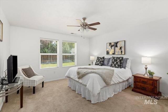4456 N Weston Ave, Meridian, ID 83646 - bedroom with light colored carpet, baseboards, and a ceiling fan