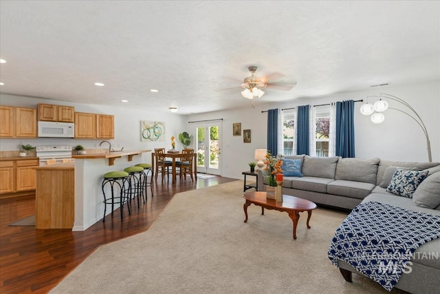4456 N Weston Ave, Meridian, ID 83646 - living area featuring dark wood-style flooring, recessed lighting, and a ceiling fan