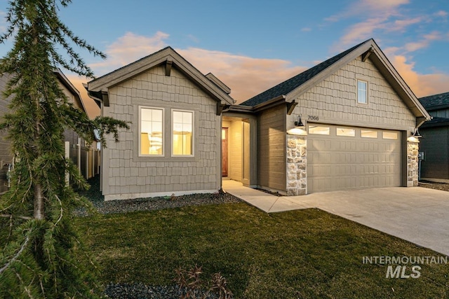 6998 S Tindaris Ave, Meridian, ID 83642 - view of front of property featuring concrete driveway, a front yard, and a garage