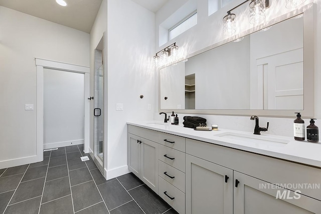 6998 S Tindaris Ave, Meridian, ID 83642 - bathroom with double vanity, a shower stall, and tile patterned flooring