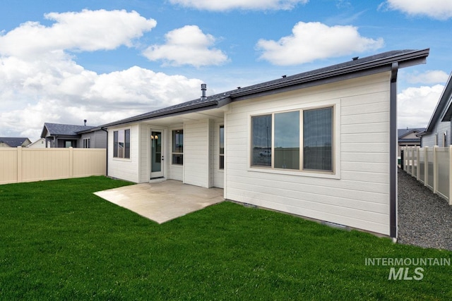 6998 S Tindaris Ave, Meridian, ID 83642 - rear view of house featuring a fenced backyard and a patio area
