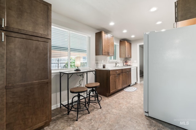 2155 N Fairmeadow Dr, Boise, ID 83704 - kitchen with white appliances, light countertops, a sink, and recessed lighting